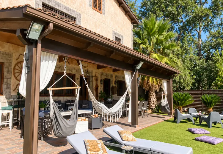 Three-storey rustic house with swimming pool, garden and large covered porch