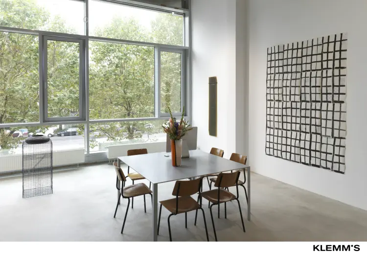 A gallery space with a ceiling height of approximately three meters.