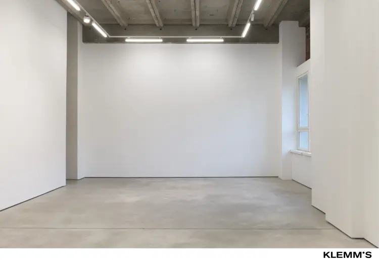 A gallery space with a ceiling height of approximately three meters.