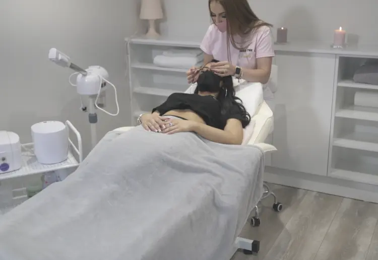 Spacious two-level salon with a big storefront window, offering a unique, elevated experience.