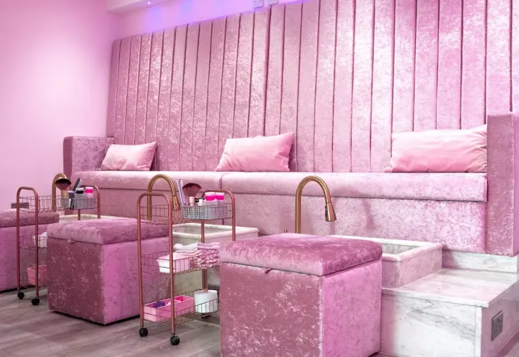 Spacious two-level salon with a big storefront window, offering a unique, elevated experience.