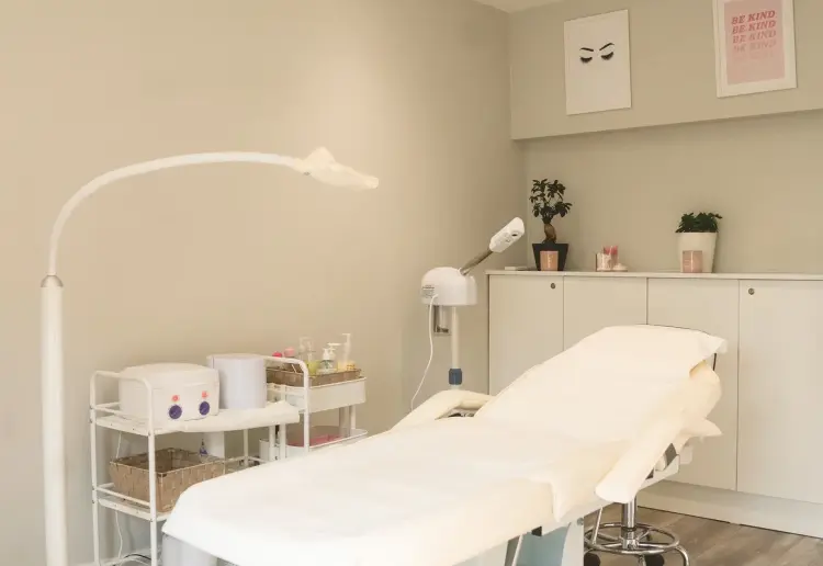 Spacious two-level salon with a big storefront window, offering a unique, elevated experience.