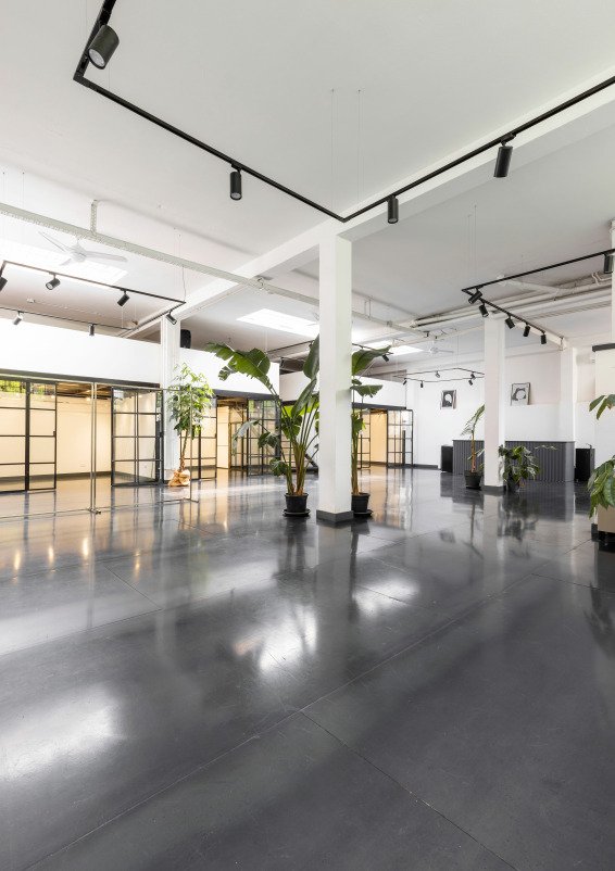 Industrial-style showroom in the Prada Foundation area