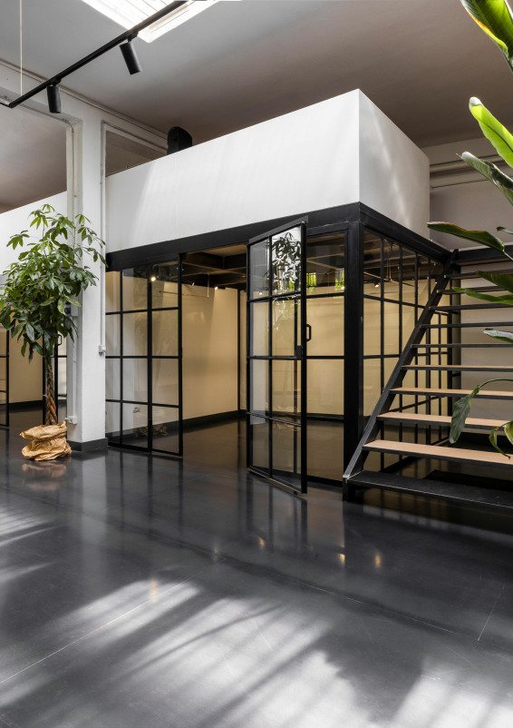 Industrial-style showroom in the Prada Foundation area