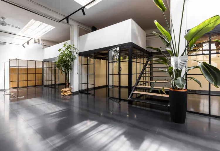 Industrial-style showroom in the Prada Foundation area