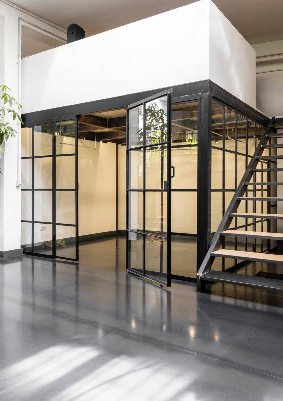 Industrial-style showroom in the Prada Foundation area