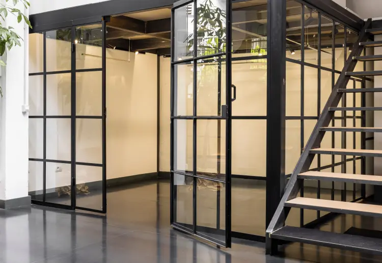 Industrial-style showroom in the Prada Foundation area