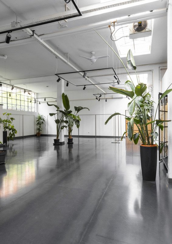 Industrial-style showroom in the Prada Foundation area