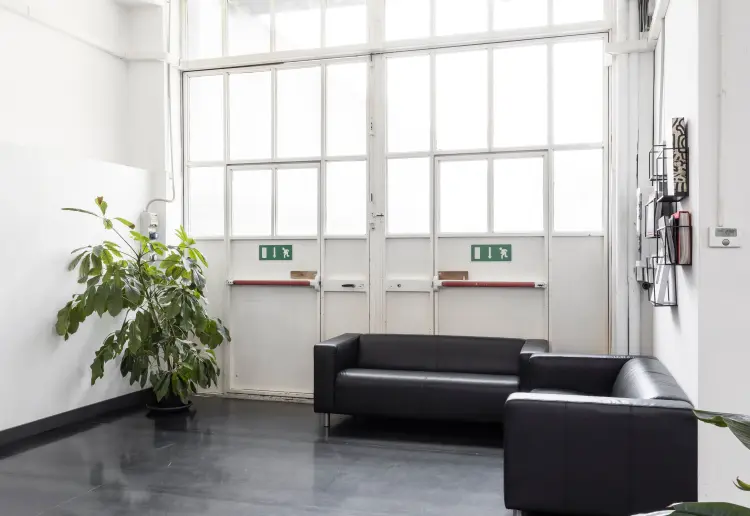 Industrial-style showroom in the Prada Foundation area