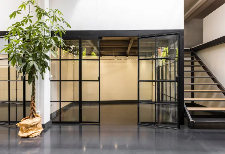 Industrial-style showroom in the Prada Foundation area