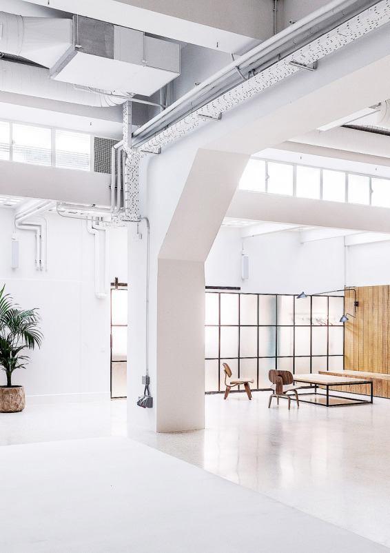 Bright open-concept space with natural light and vehicle access.