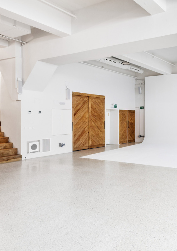 Bright open-concept space with natural light and vehicle access.