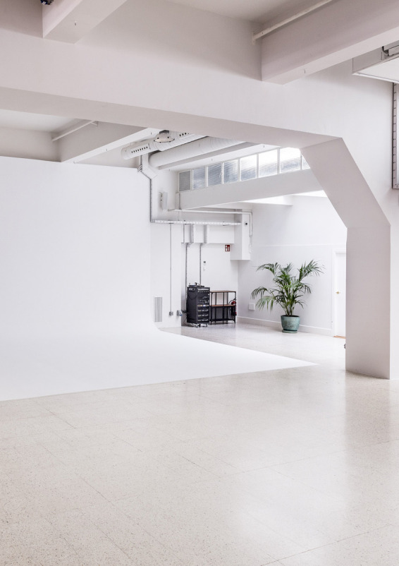Bright open-concept space with natural light and vehicle access.