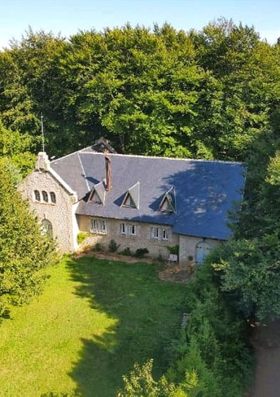 Unique beautiful building with a former church in the heart of a beech forest