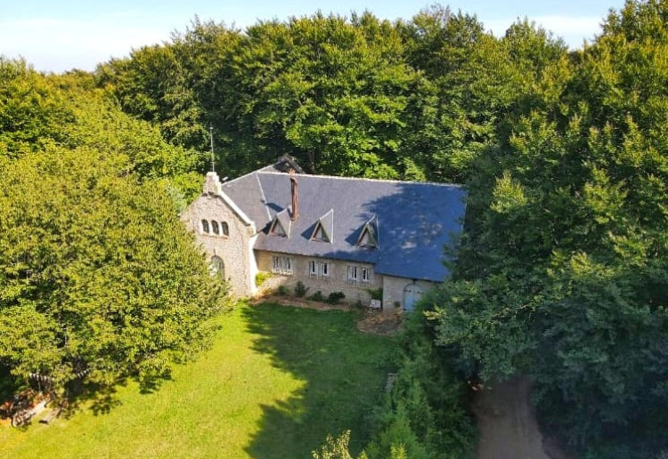 Unique beautiful building with a former church in the heart of a beech forest