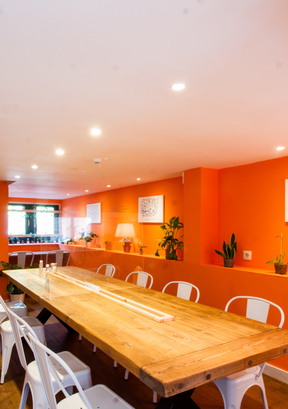Cosy private dining hall with big wooden table that seats 10 people
