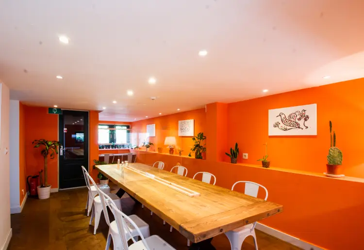 Cosy private dining hall with big wooden table that seats 10 people