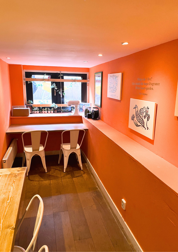 Cosy private dining hall with big wooden table that seats 10 people