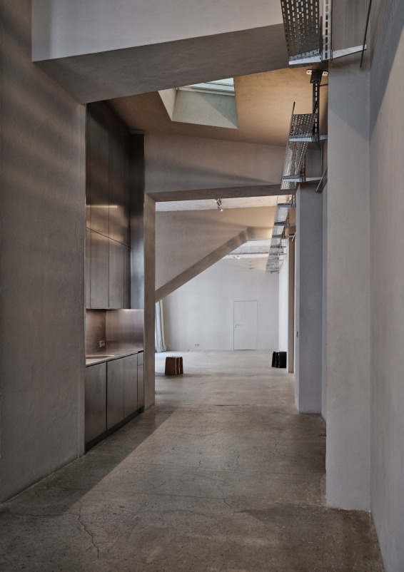 Minimalist gallery with concrete floors and walls