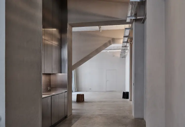 Minimalist gallery with concrete floors and walls