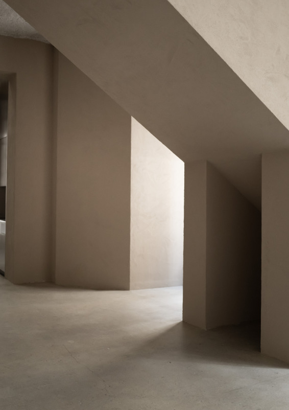 Minimalist gallery with concrete floors and walls