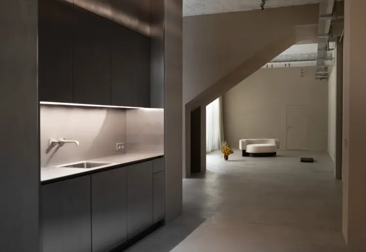 Minimalist gallery with concrete floors and walls